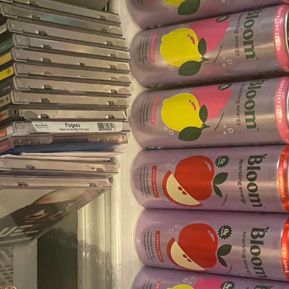 Bloom Sparkling Energy Drink in Pink and Purple Cans